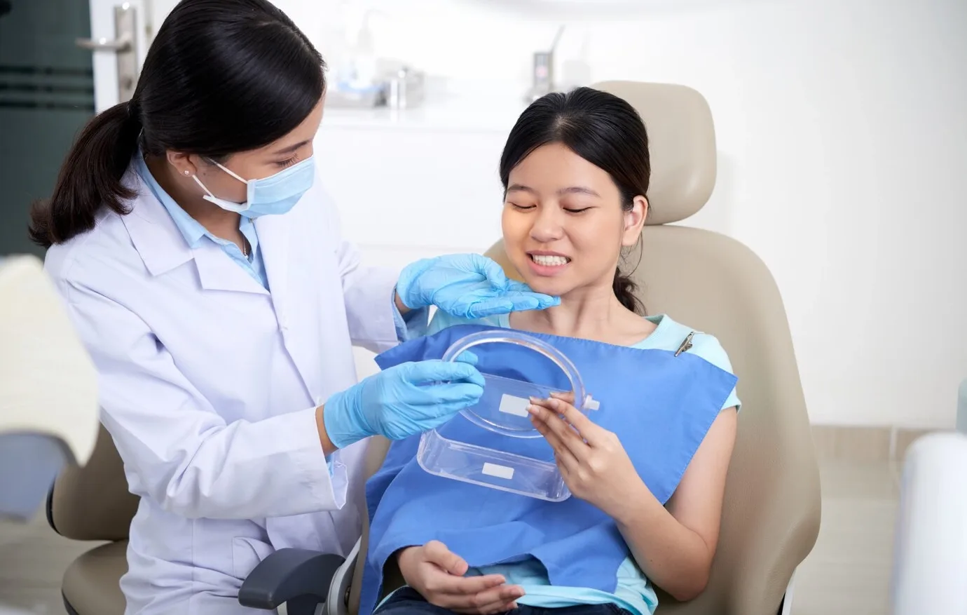 Dentist explaining treatment to a patient at Dental Leaf Multi Speciality Dental Clinic